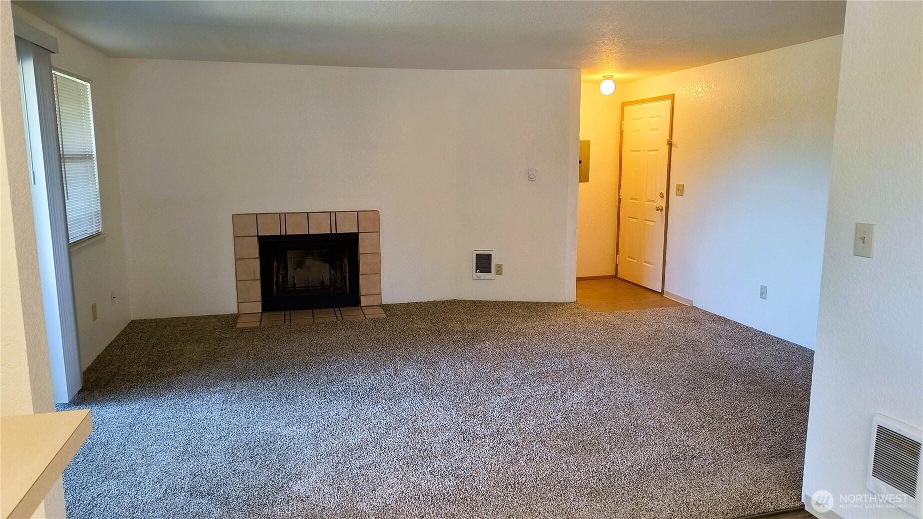 13232 Ambaum Boulevard Southwest Burien, WA 98146 - Photo 11 of 22 a view of empty room with a fireplace