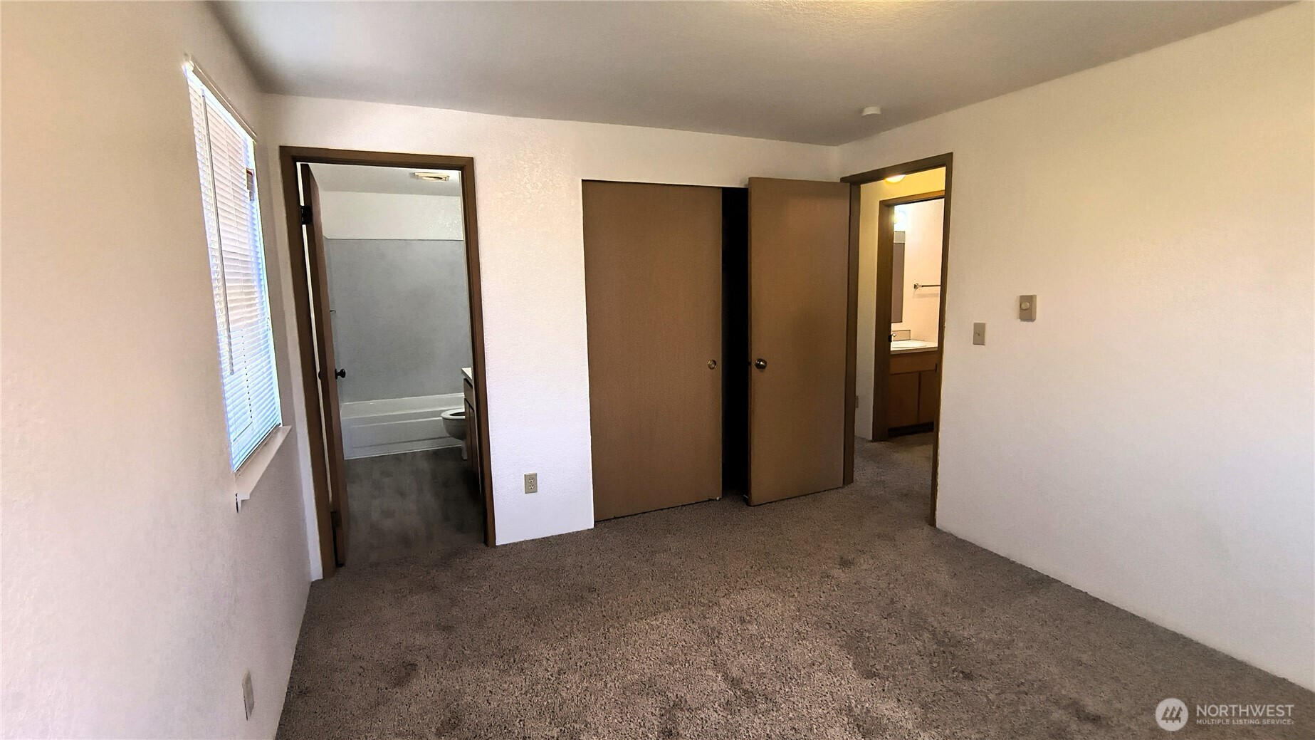 13232 Ambaum Boulevard Southwest Burien, WA 98146 - Photo 18 of 22 an empty room with closet and a bathroom