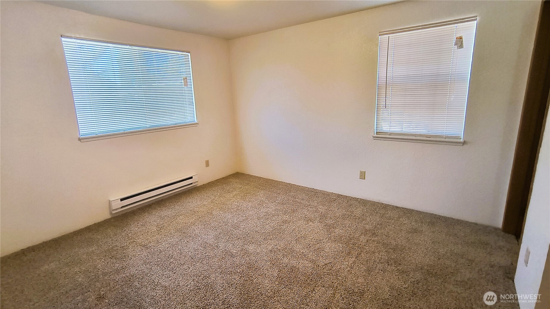 13232 Ambaum Boulevard Southwest Burien, WA 98146 - Photo 20 of 22 an empty room with windows