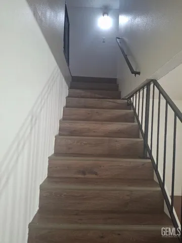 a kitchen with granite countertop a sink a stove and a granite counter tops