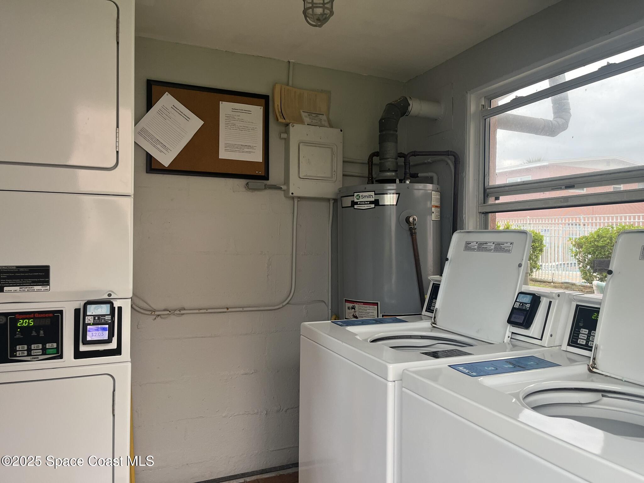 415 Madison Avenue, Unit I102 Cape Canaveral, FL 32920 - Photo 28 of 29 a stove top oven sitting inside of a kitchen