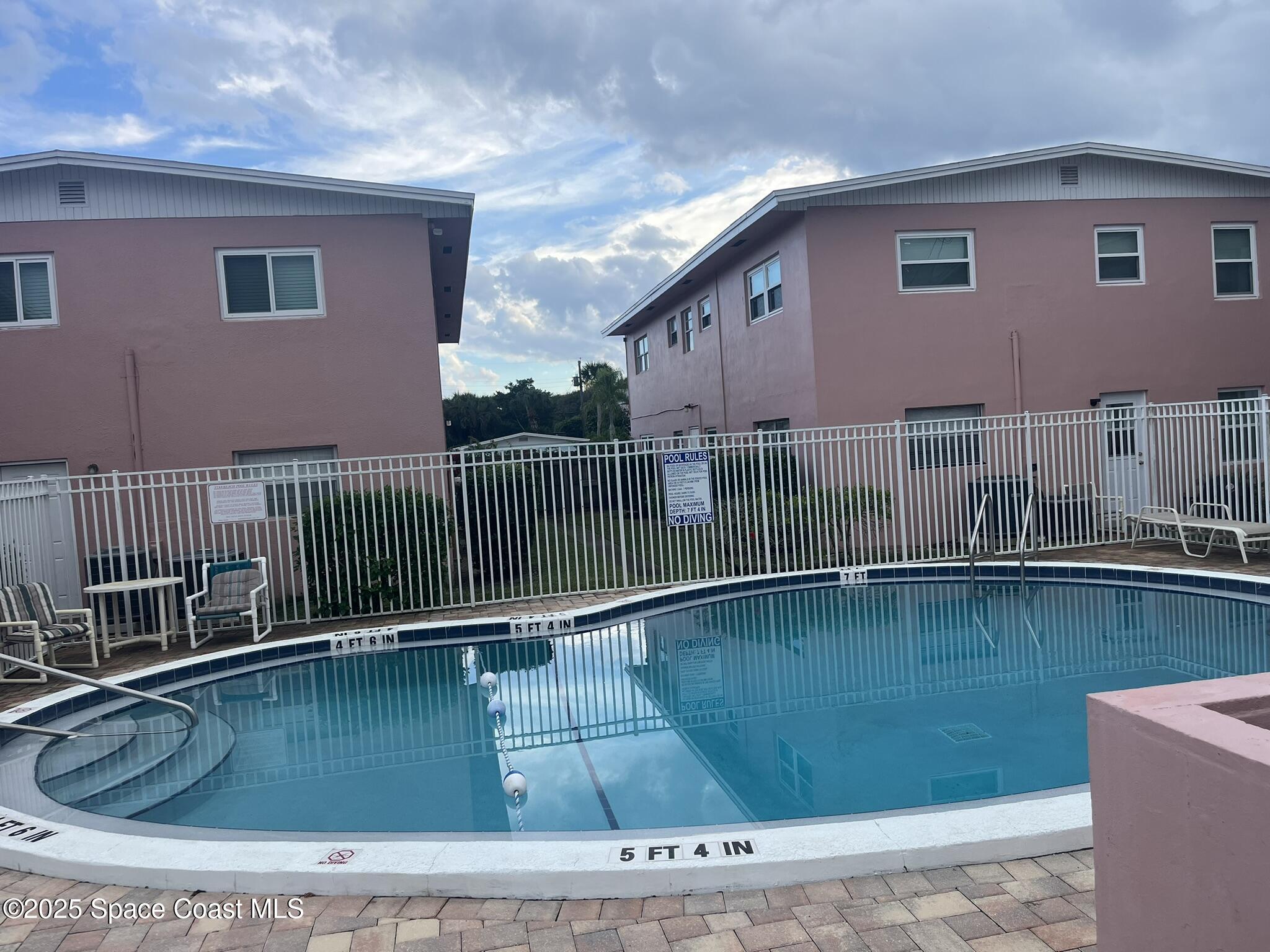 415 Madison Avenue, Unit I102 Cape Canaveral, FL 32920 - Photo 29 of 29 a view of a house with swimming pool