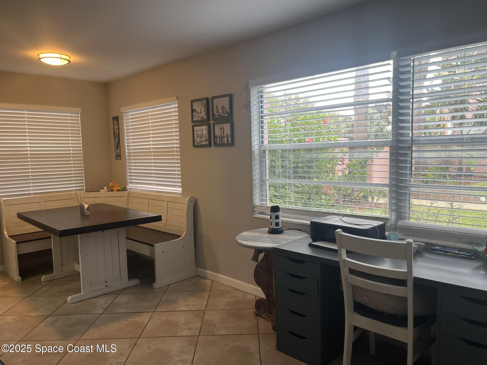 415 Madison Avenue, Unit I102 Cape Canaveral, FL 32920 - Photo 5 of 29 a view of a workspace with furniture and a window