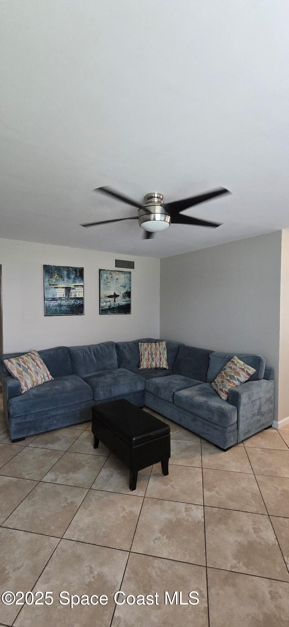 415 Madison Avenue, Unit I102 Cape Canaveral, FL 32920 - Photo 10 of 29 a living room with furniture and a couch