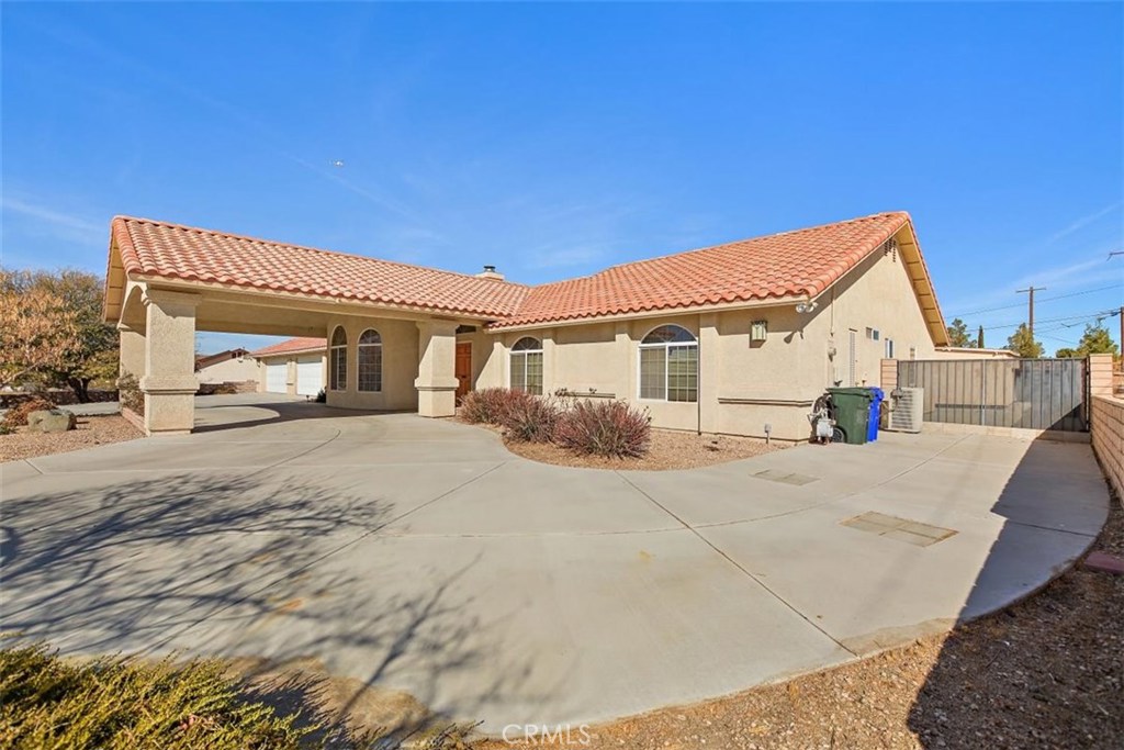 15085 Miami Road Apple Valley, CA 92307 - Photo 1 of 1 a view of white house with a outdoor space