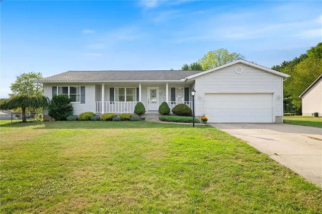 a view of a house with a garden