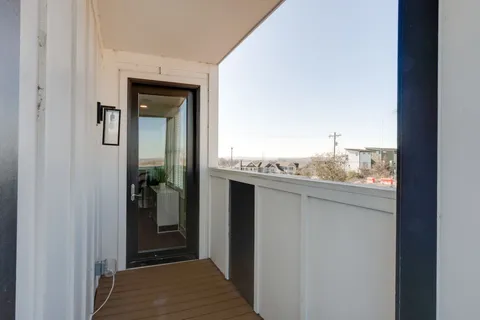 a view of a hallway with a bathroom