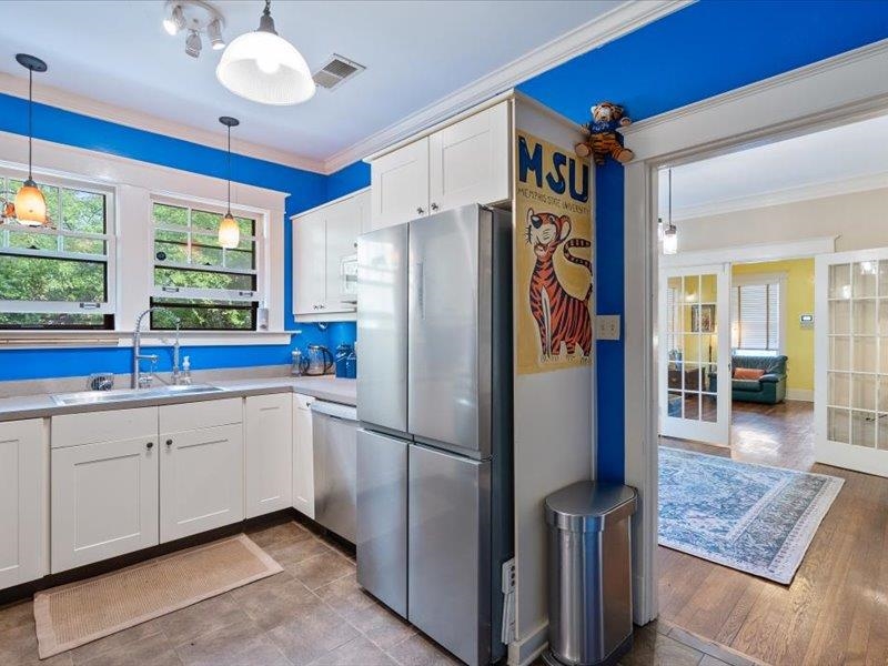 793 Rozelle Street Memphis, TN 38104 - Photo 16 of 33 a kitchen with stainless steel appliances granite countertop a refrigerator and a sink