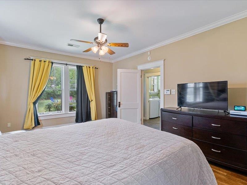 793 Rozelle Street Memphis, TN 38104 - Photo 20 of 33 a bedroom with a large bed and a flat tv screen on dresser