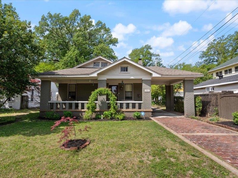 793 Rozelle Street Memphis, TN 38104 - Photo 2 of 33 a front view of a house with garden