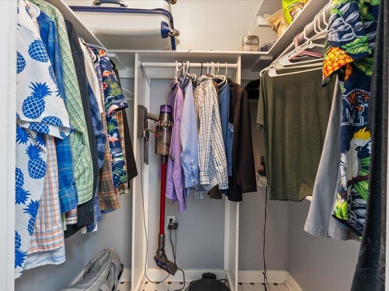 793 Rozelle Street Memphis, TN 38104 - Photo 22 of 33 a view of walk in closet with clothes and shoes