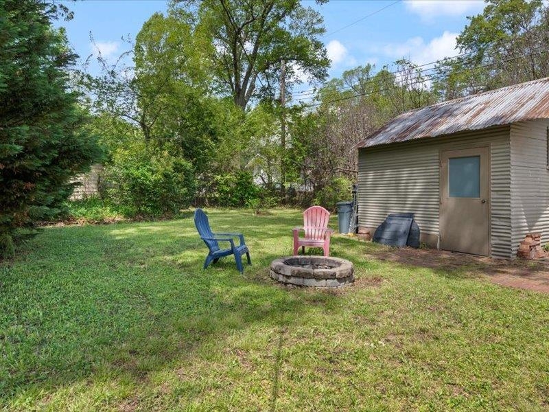 793 Rozelle Street Memphis, TN 38104 - Photo 28 of 33 a view of back yard of the house with outdoor seating