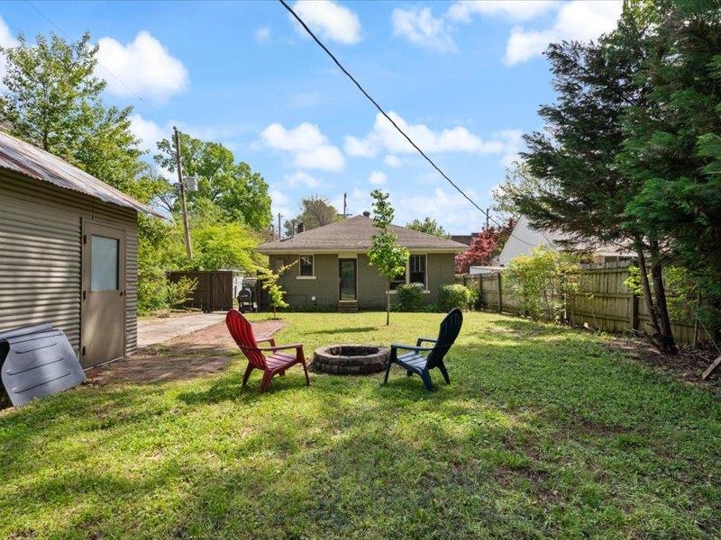 793 Rozelle Street Memphis, TN 38104 - Photo 31 of 33 a swimming pool with outdoor seating and yard