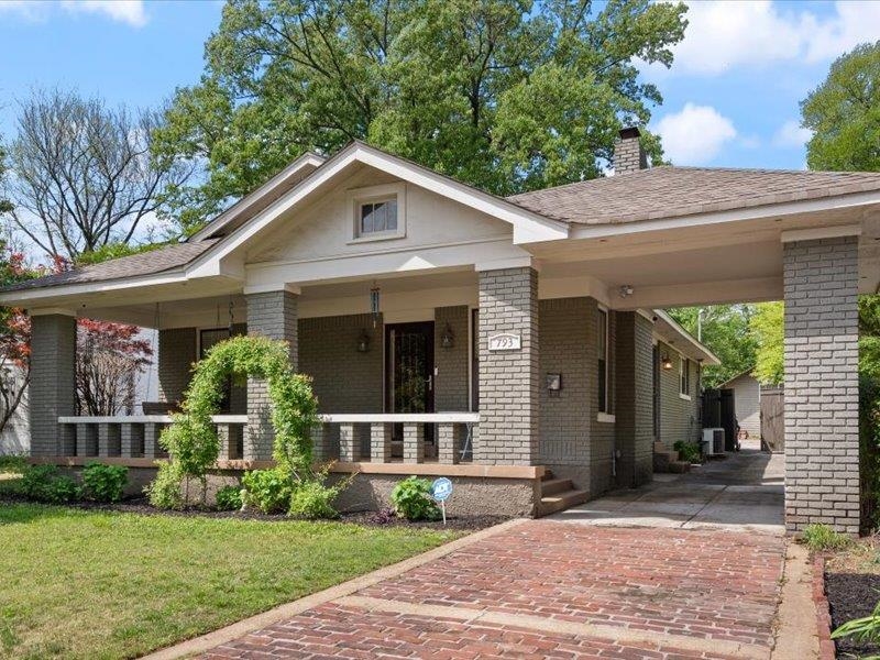 793 Rozelle Street Memphis, TN 38104 - Photo 4 of 33 a front view of a house with a yard
