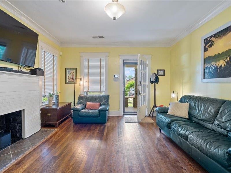 793 Rozelle Street Memphis, TN 38104 - Photo 8 of 33 a living room with furniture and a flat screen tv