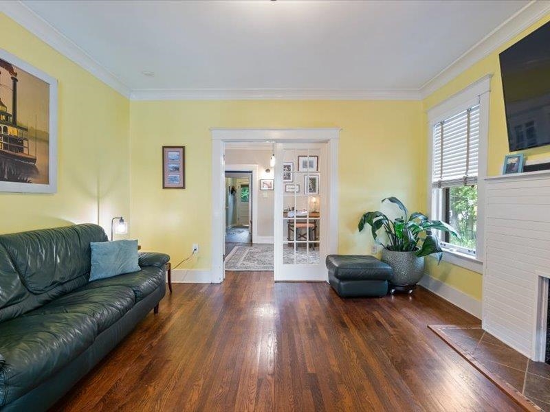 793 Rozelle Street Memphis, TN 38104 - Photo 9 of 33 a living room with furniture and a potted plant