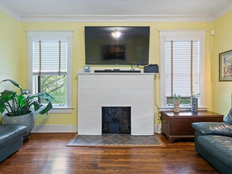 793 Rozelle Street Memphis, TN 38104 - Photo 10 of 33 a living room with fireplace furniture and a flat screen tv