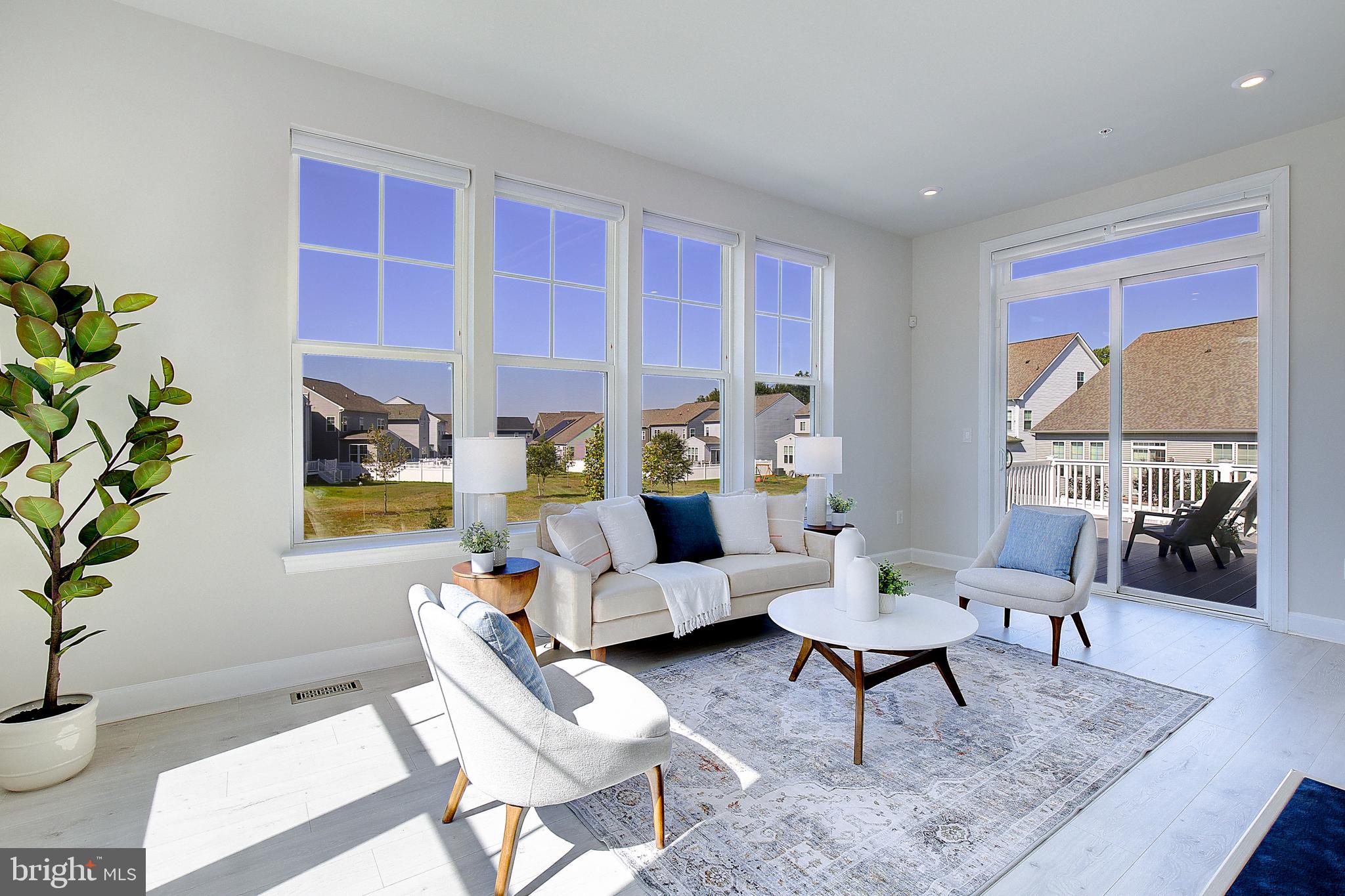 1126 White Clover Lane Odenton, MD 21113 - Photo 23 of 92 a living room with furniture and a potted plant