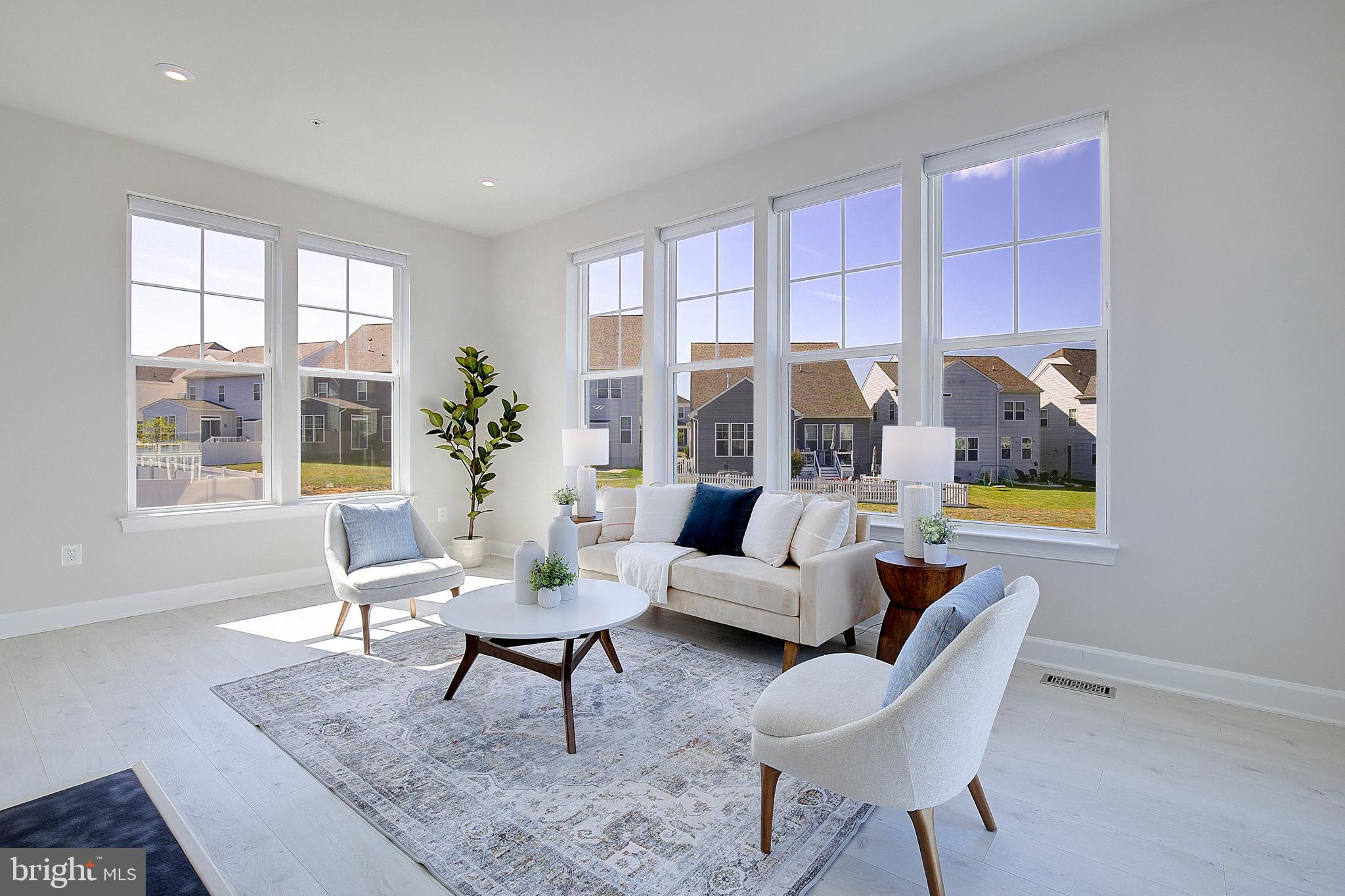 1126 White Clover Lane Odenton, MD 21113 - Photo 25 of 92 a living room with furniture and a potted plant