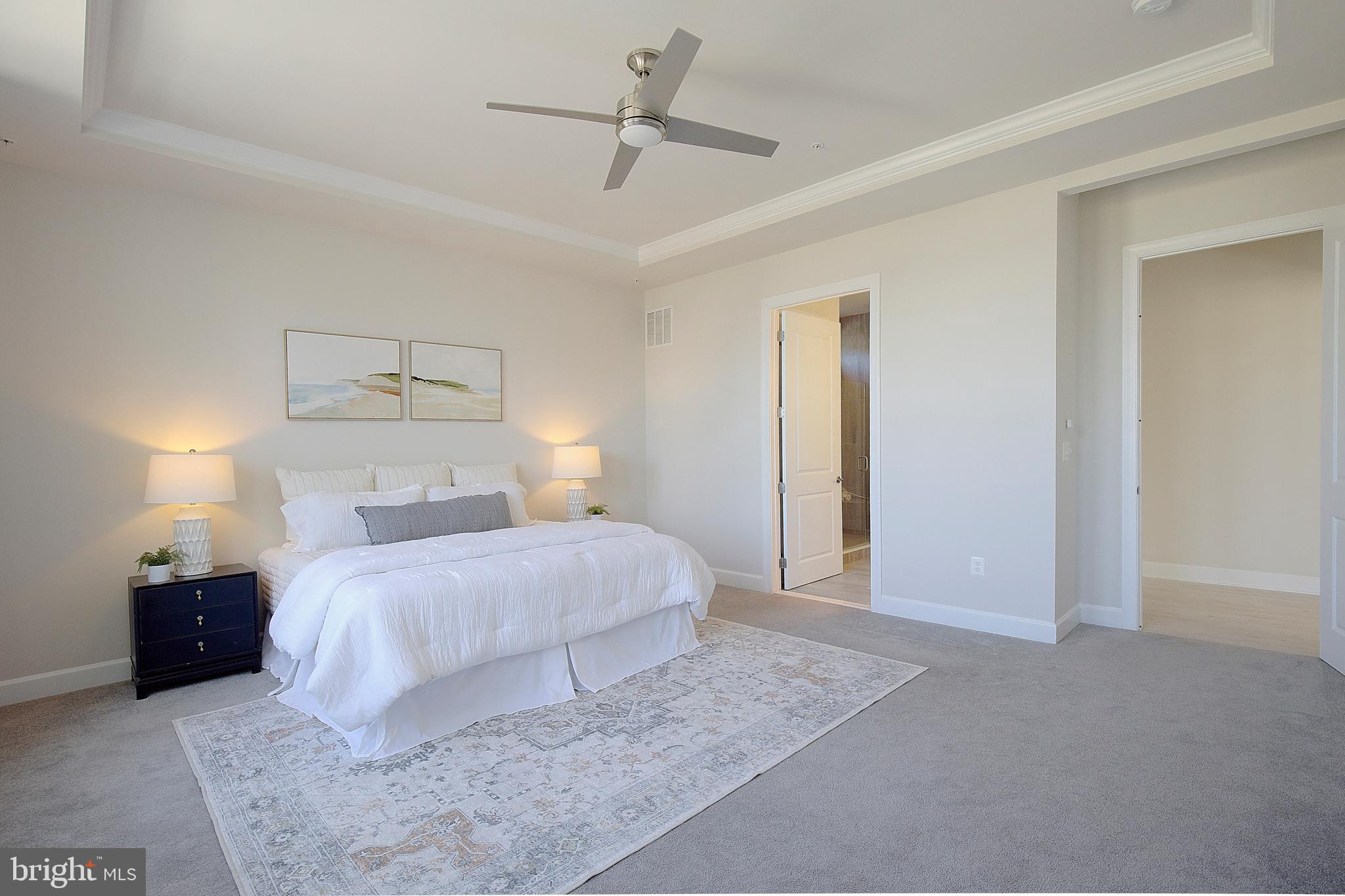 1126 White Clover Lane Odenton, MD 21113 - Photo 30 of 92 a bedroom with a bed and a lamp