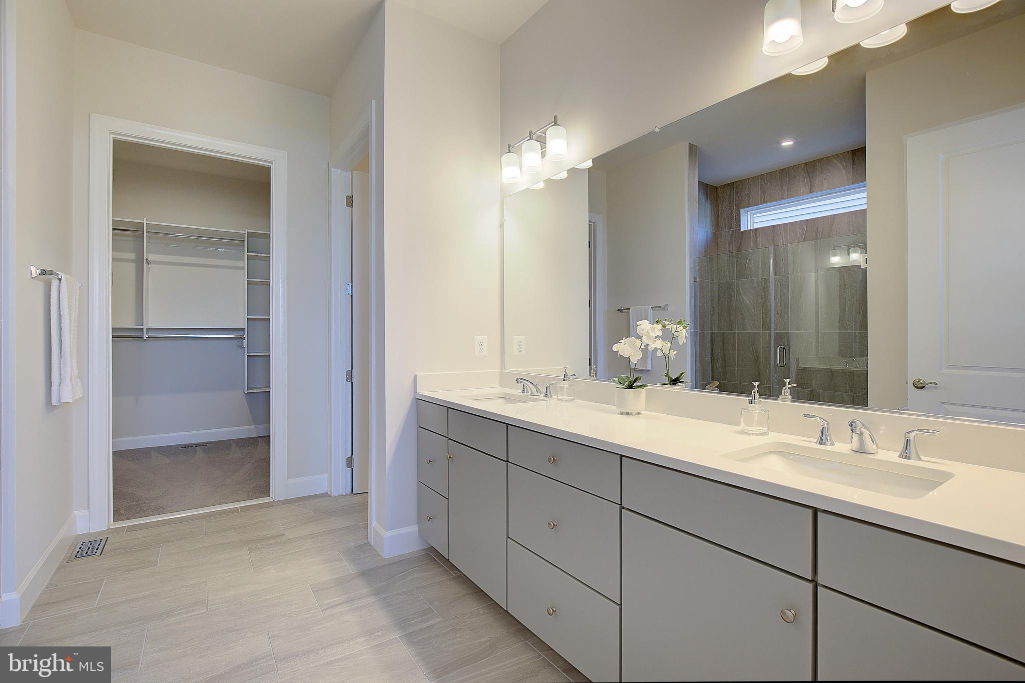 1126 White Clover Lane Odenton, MD 21113 - Photo 34 of 92 a bathroom with a sink and a mirror