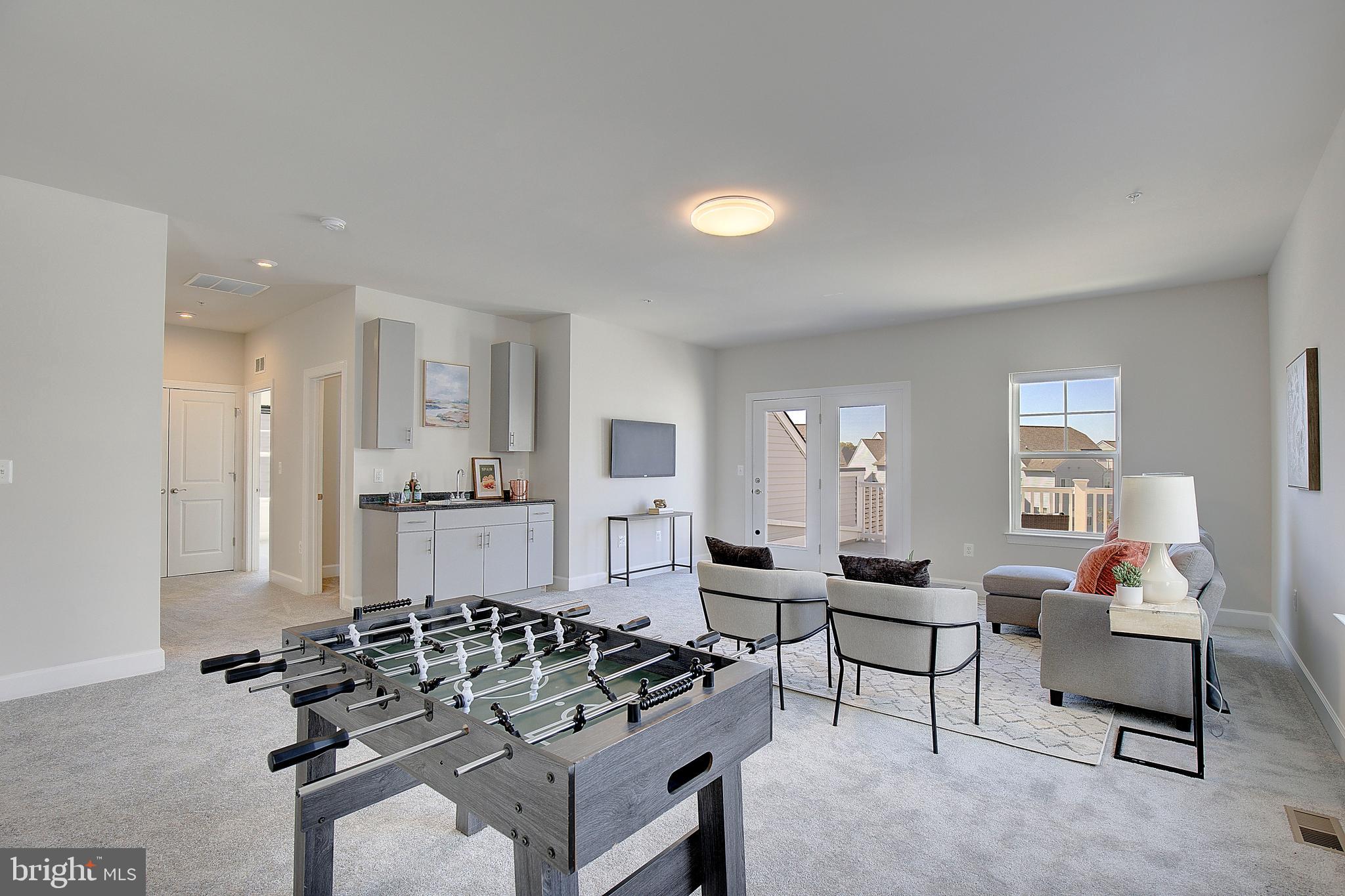 1126 White Clover Lane Odenton, MD 21113 - Photo 36 of 92 a living room with furniture and a wooden floor