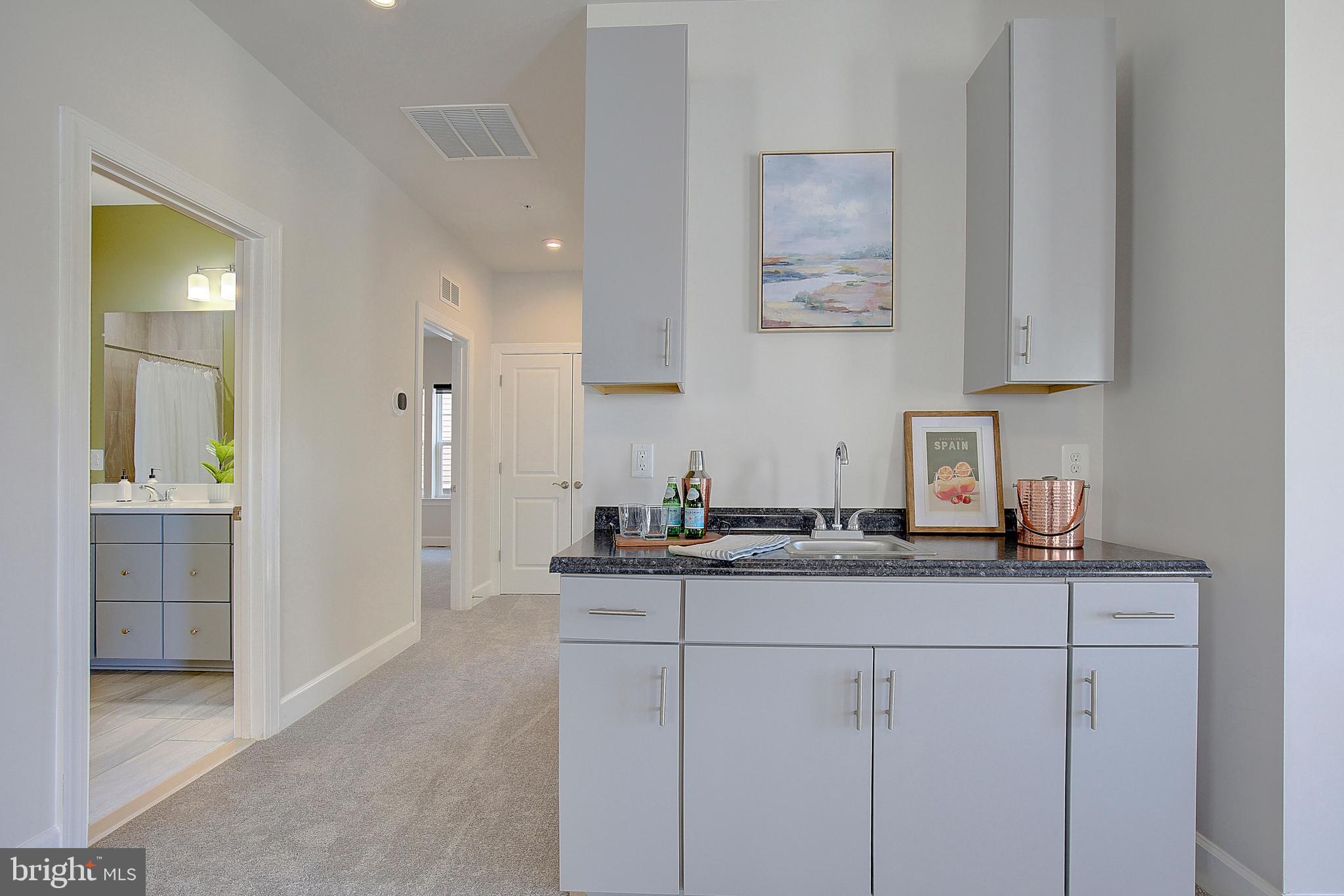 1126 White Clover Lane Odenton, MD 21113 - Photo 38 of 92 a kitchen with stainless steel appliances granite countertop a sink and cabinets