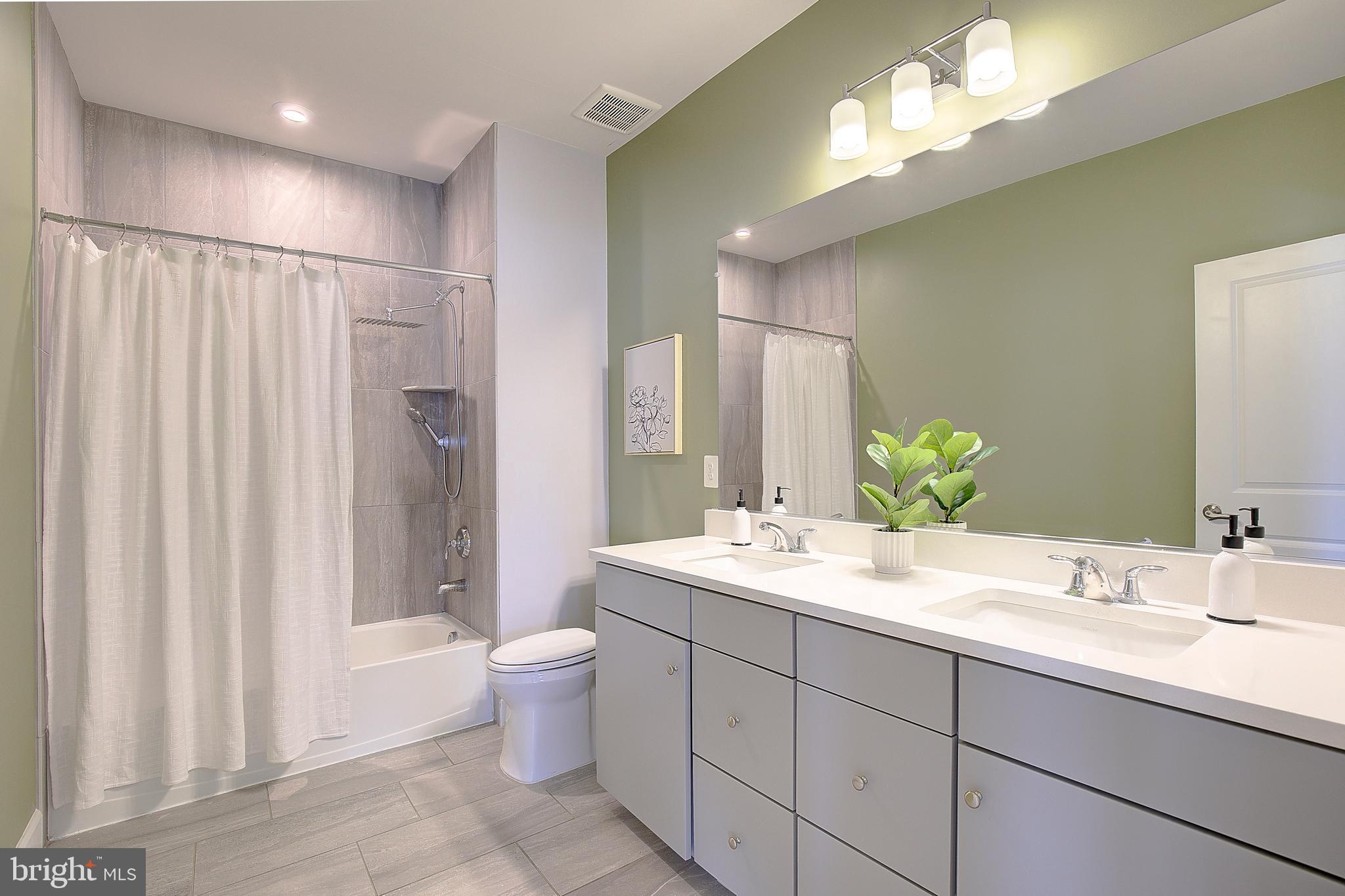 1126 White Clover Lane Odenton, MD 21113 - Photo 46 of 92 a spacious bathroom with a double vanity sink mirror and toilet