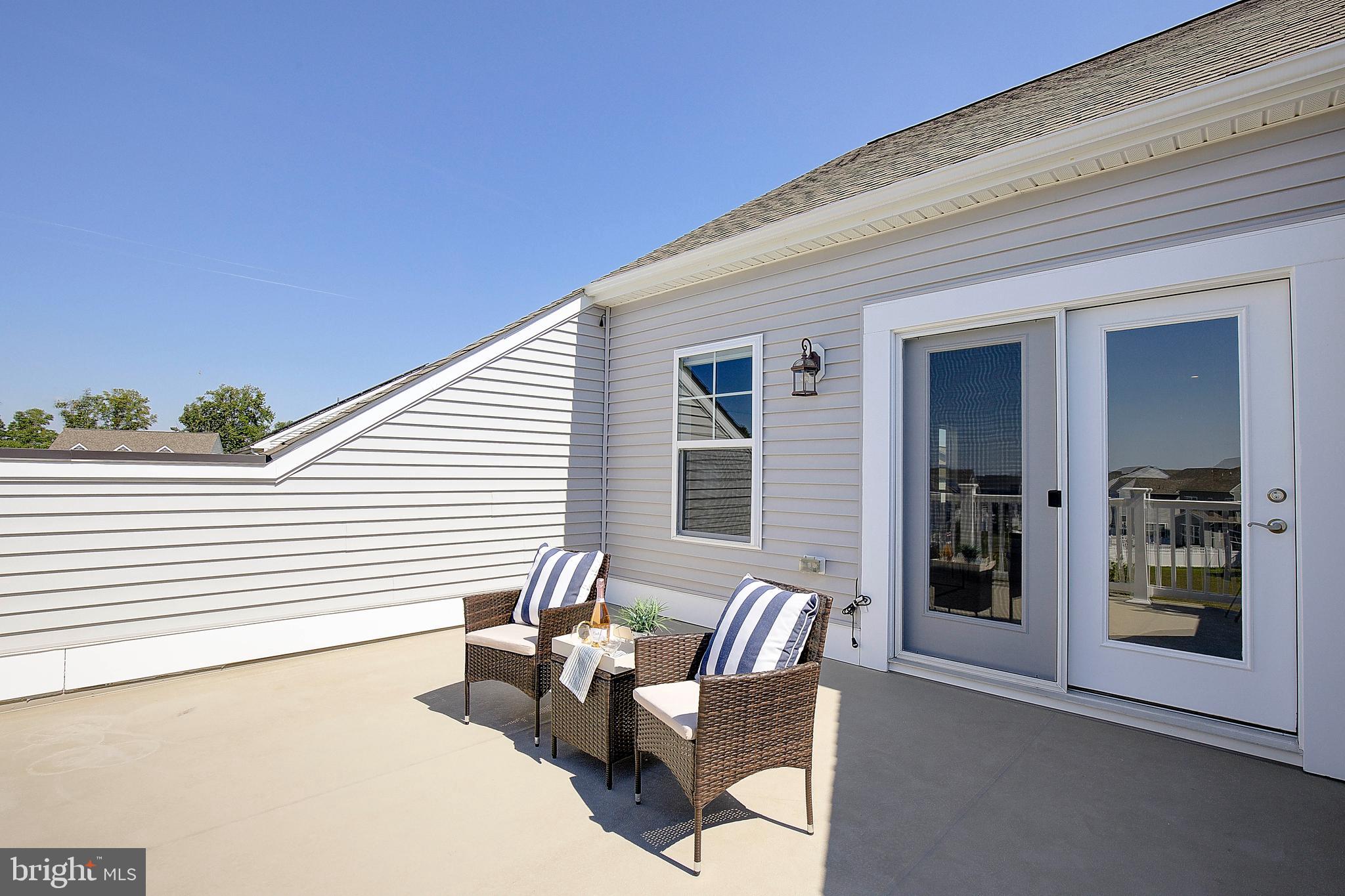 1126 White Clover Lane Odenton, MD 21113 - Photo 52 of 92 a view of a patio with couches and potted plants
