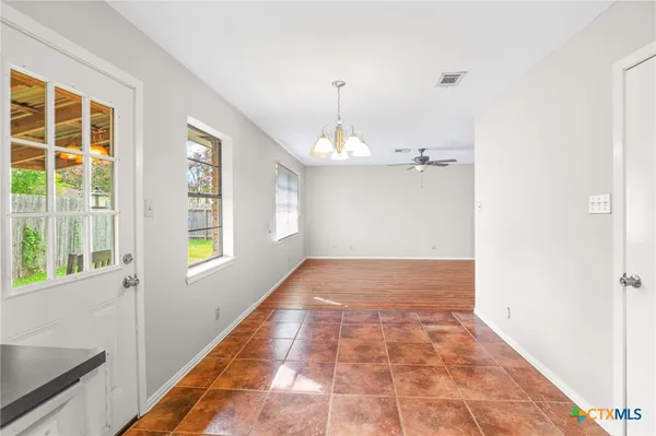 a view of an empty room and window