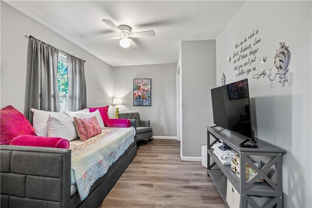 2220 Lee Street Southwest Covington, GA 30014 - Photo 11 of 30 a living room with furniture and a flat screen tv
