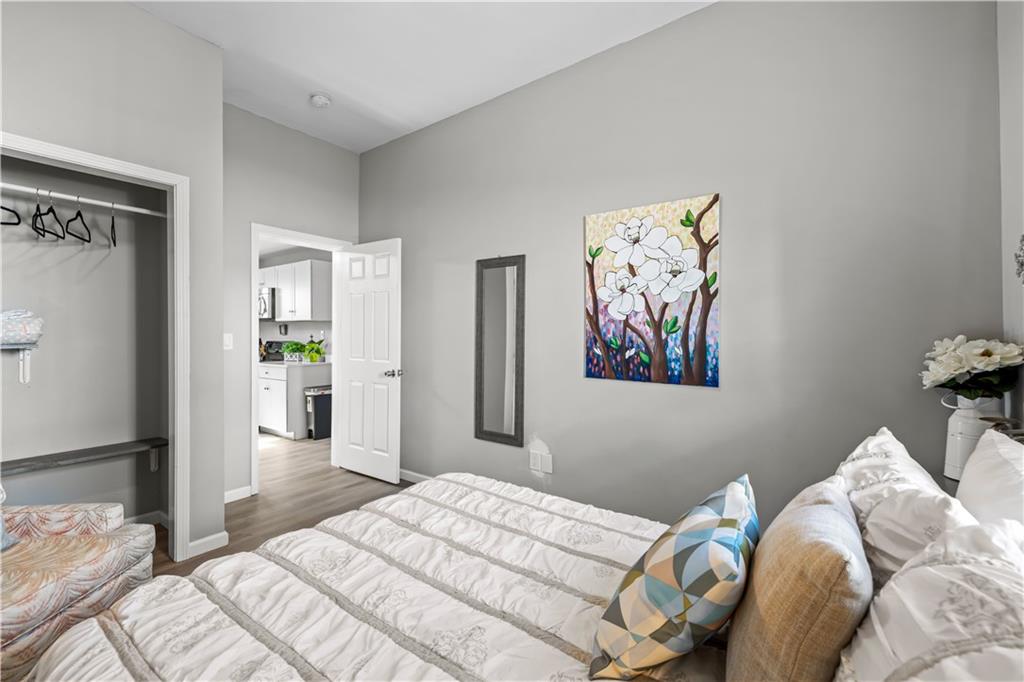 2220 Lee Street Southwest Covington, GA 30014 - Photo 17 of 30 a bedroom with a bed and painting on the wall