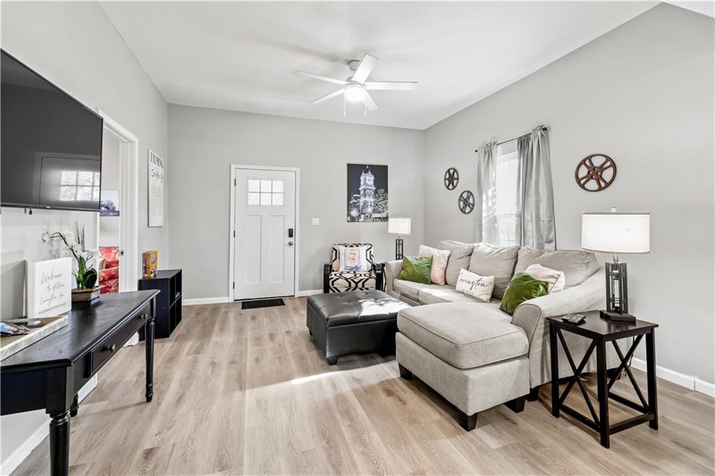 2220 Lee Street Southwest Covington, GA 30014 - Photo 19 of 30 a living room with furniture and a flat screen tv