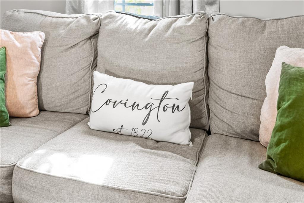 2220 Lee Street Southwest Covington, GA 30014 - Photo 20 of 30 a white bed sitting in a room