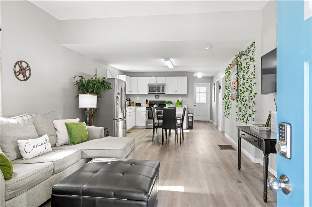 2220 Lee Street Southwest Covington, GA 30014 - Photo 2 of 30 a living room with furniture and wooden floor