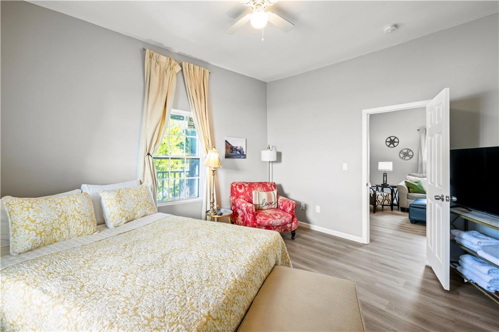 2220 Lee Street Southwest Covington, GA 30014 - Photo 23 of 30 a bedroom with a bed and wooden floor