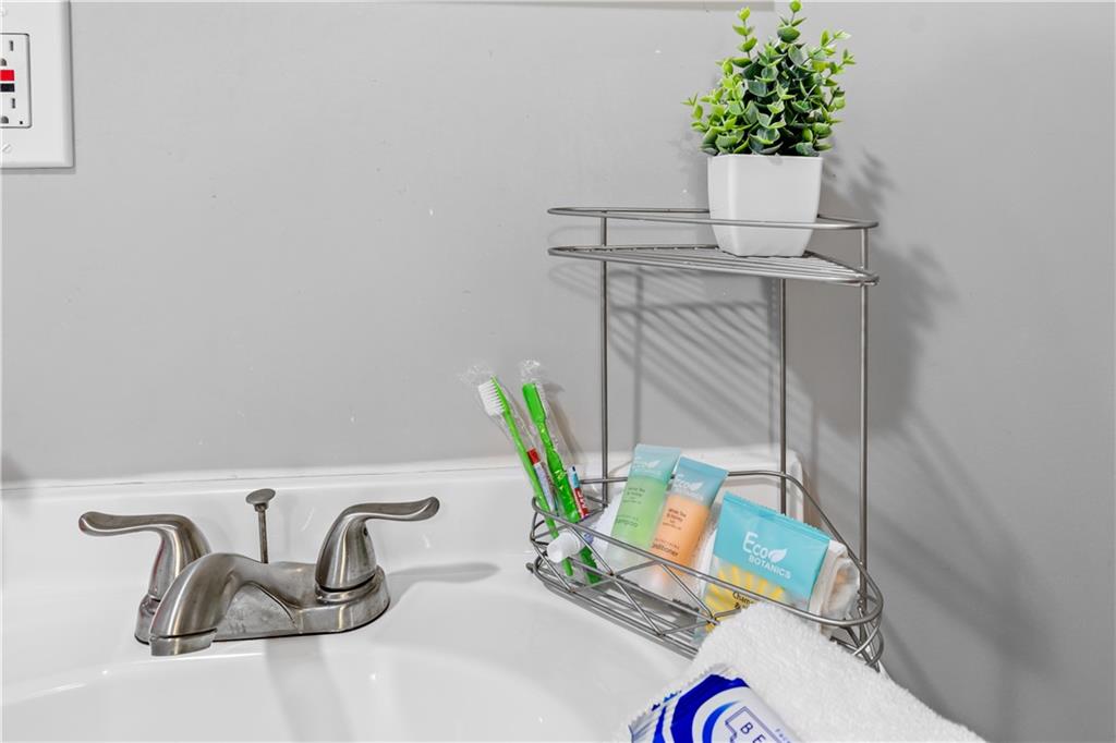 2220 Lee Street Southwest Covington, GA 30014 - Photo 26 of 30 a table with a vase and flowers on it