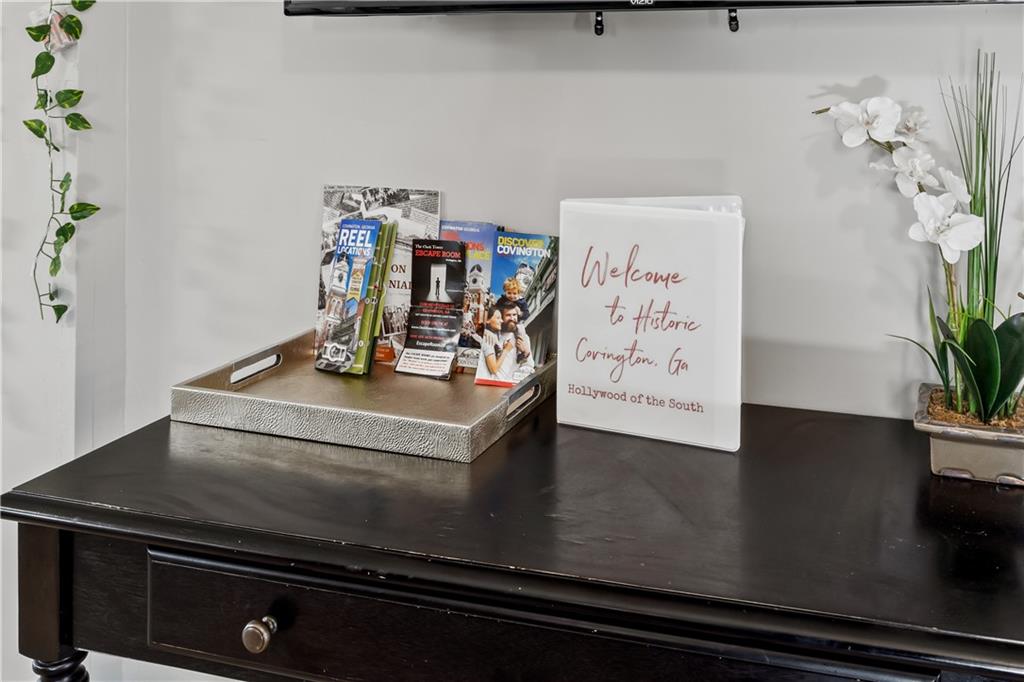 2220 Lee Street Southwest Covington, GA 30014 - Photo 30 of 30 a view of a kitchen with kitchen island a stove and a potted plant
