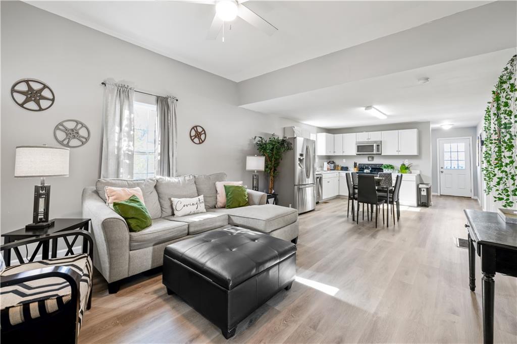 2220 Lee Street Southwest Covington, GA 30014 - Photo 3 of 30 a living room with furniture and wooden floor