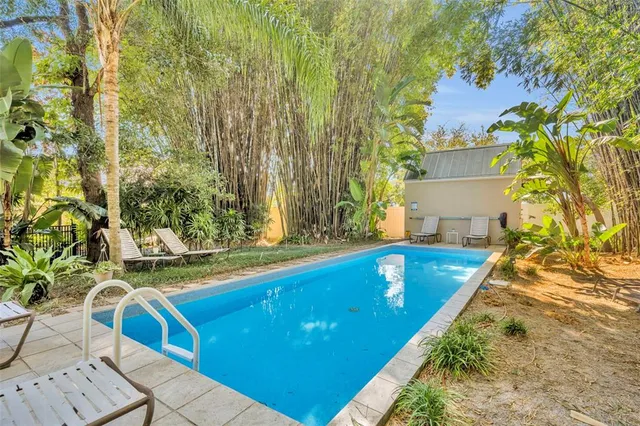 a view of swimming pool with chairs