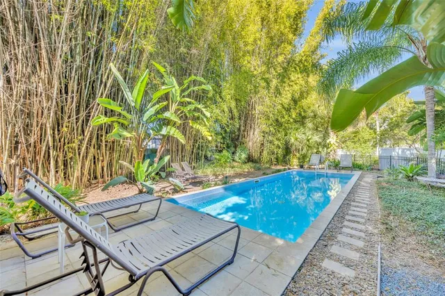 a view of a swimming pool with a lounge chairs