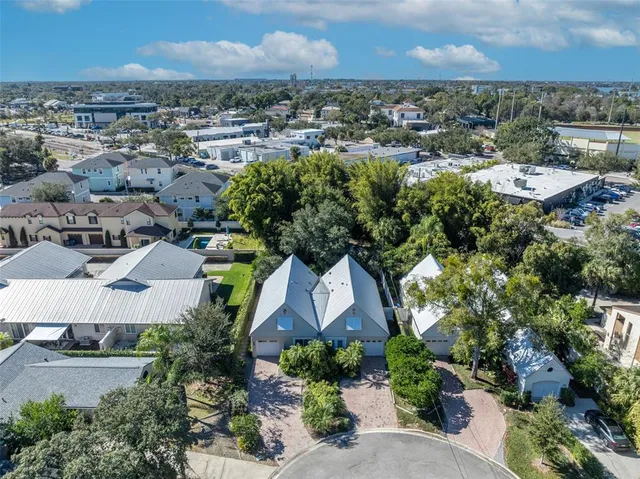 an aerial view of residential houses with outdoor space