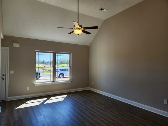 a kitchen with granite countertop a stove and a sink