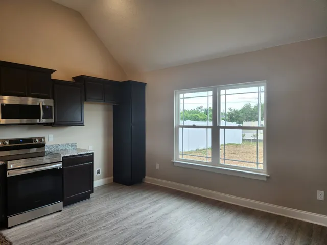 a bathroom with a sink a toilet and vanity