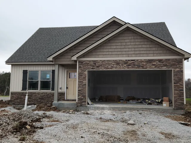 a front view of a house with yard