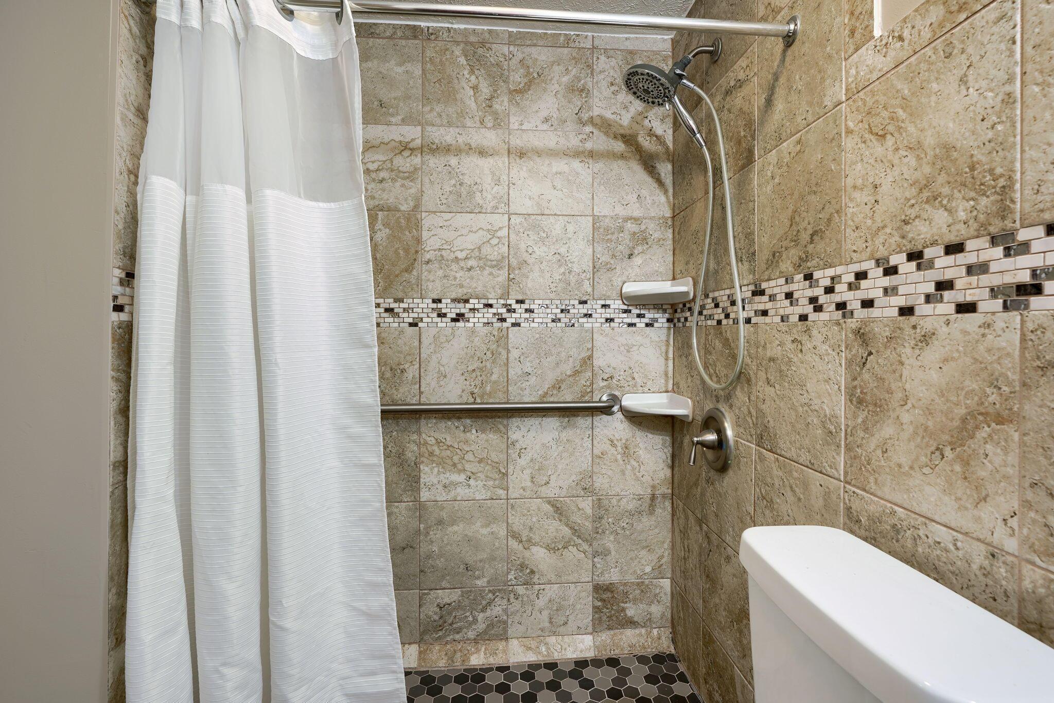 932 Demorest Road Columbus, OH 43204 - Photo 28 of 44 Updated ceramic tile flooring, ceramic shower surround, commode & sink.
