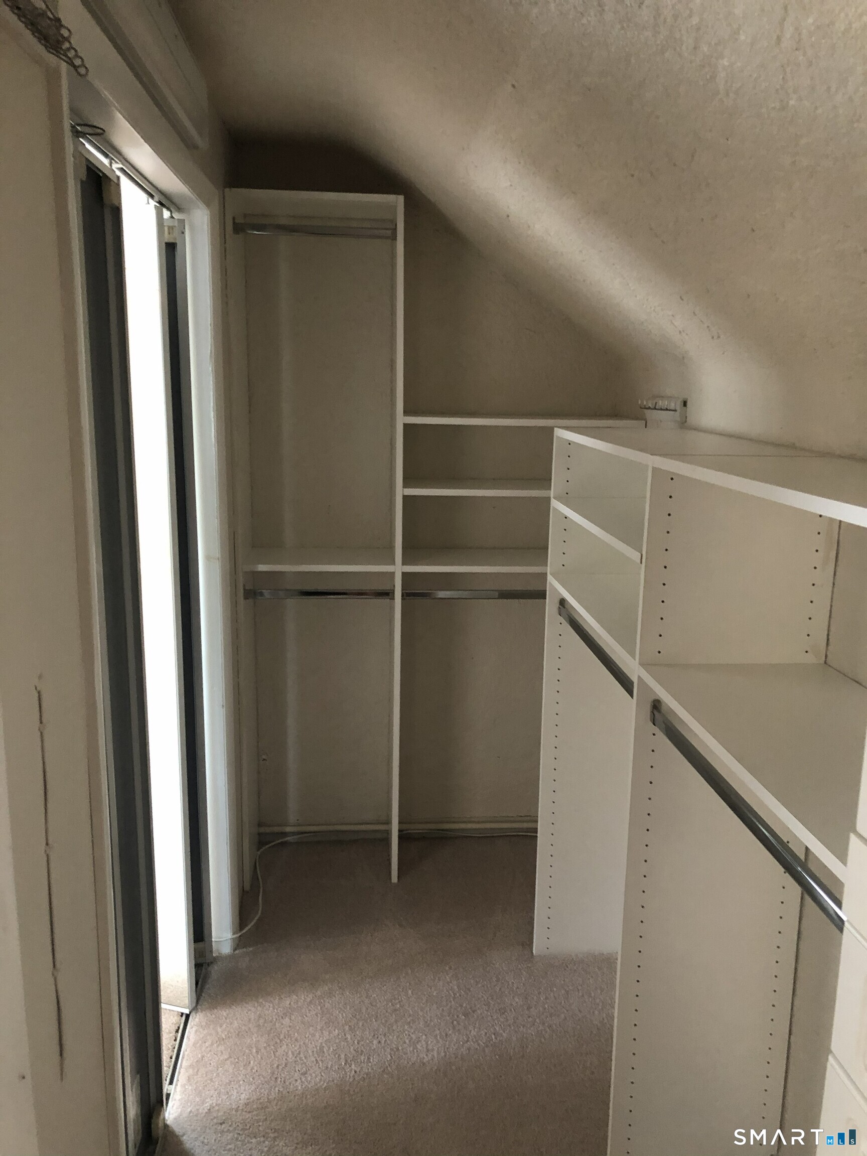 311 Racebrook Road Orange, CT 06477 - Photo 12 of 12 a view of an empty walk in closet