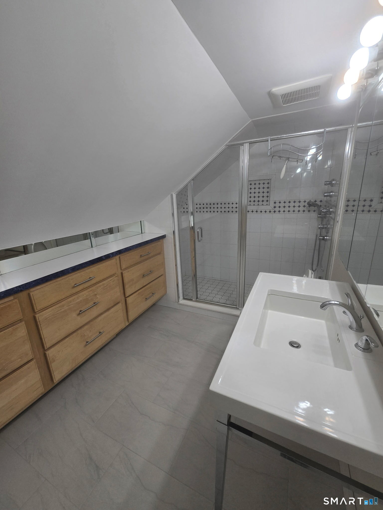 311 Racebrook Road Orange, CT 06477 - Photo 8 of 12 a bathroom with a sink and a mirror