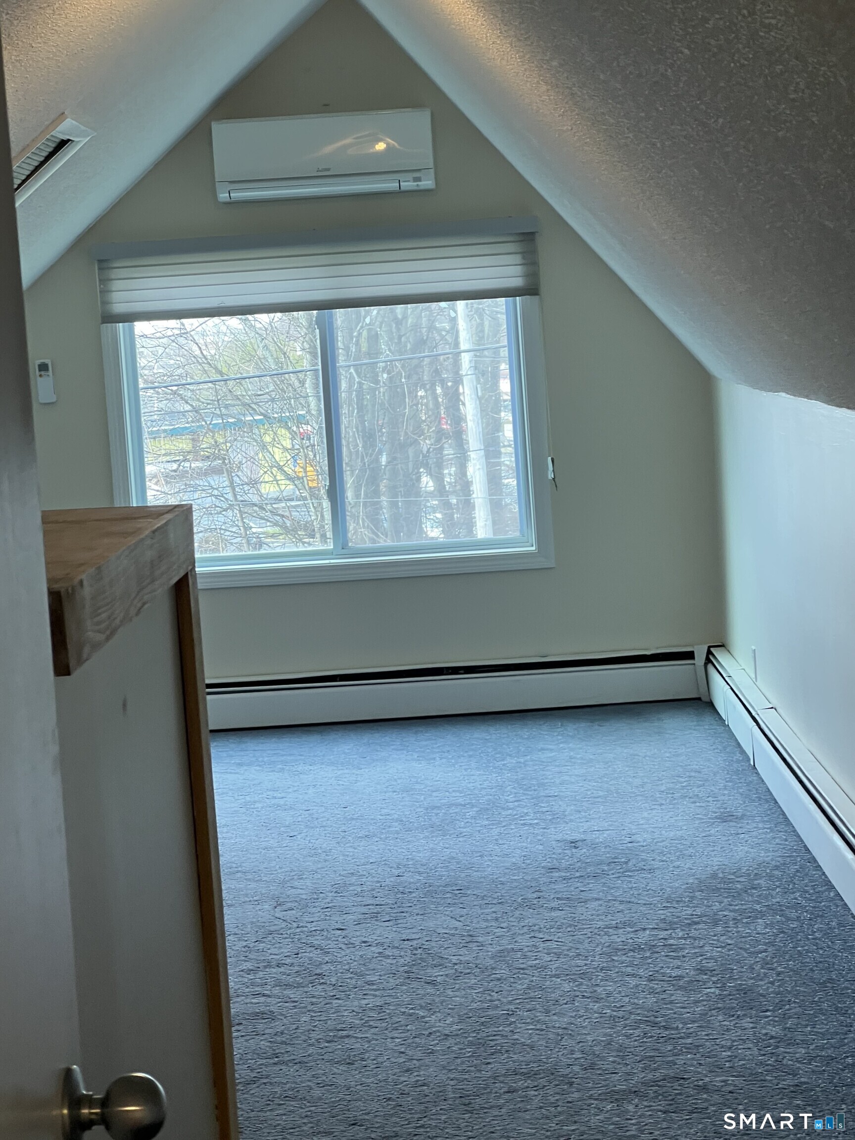 311 Racebrook Road Orange, CT 06477 - Photo 9 of 12 a view of a room that has a window in it