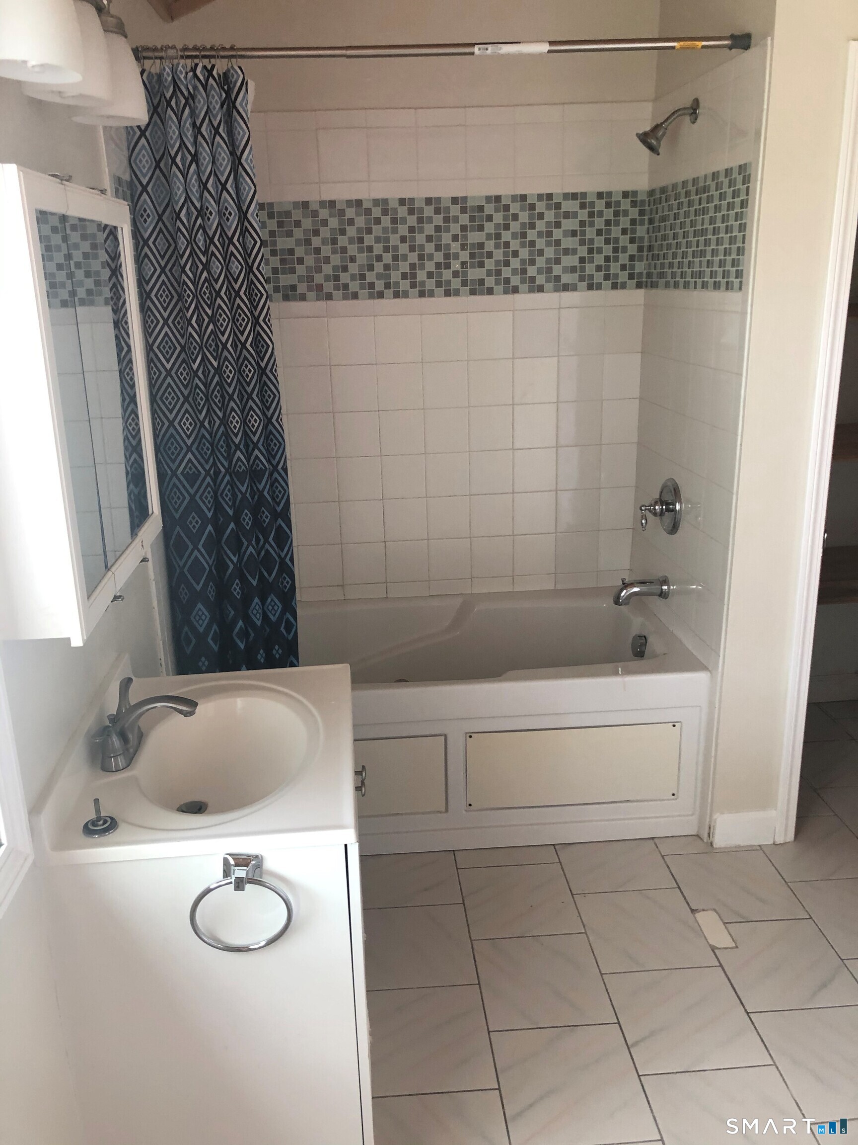 311 Racebrook Road Orange, CT 06477 - Photo 10 of 12 a bathroom with a sink and a tub